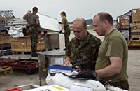 RAF movements personnel prepare to load a C-17 transport aircraft with UN Humanitarian Aid parcels and equiment at Panang airport for delivery to Banda Aceh in Sumatra.