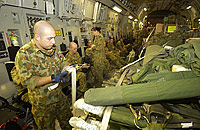 Australian and RAF movements crews securing a load in the C-17.