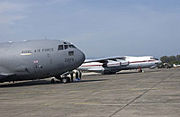 The C-17 parked at Butterworth  alongside a Russian-built Il-76 transport. Both aircraft were used in the delivery of much-needed aid.